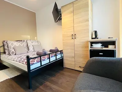 Łóżko lub łóżka w pokoju w obiekcie Na Turystycznej-apartamenty i pokoje w sercu uzdrowiska