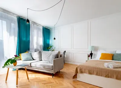 Łóżko lub łóżka w pokoju w obiekcie Apartament Różowy Jeleń