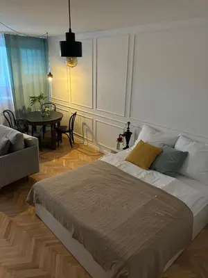 Łóżko lub łóżka w pokoju w obiekcie Apartament Różowy Jeleń