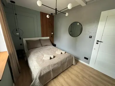 Łóżko lub łóżka w pokoju w obiekcie Dach Pod Sową Apartament GS