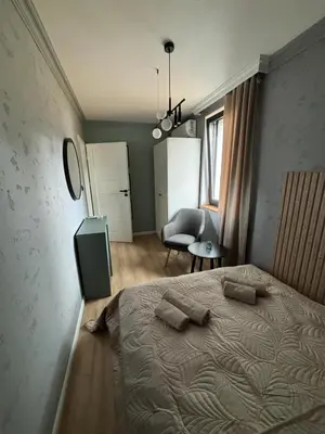 Łóżko lub łóżka w pokoju w obiekcie Dach Pod Sową Apartament GS