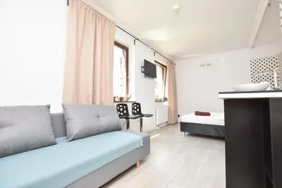 Telewizja i/lub zestaw kina domowego w obiekcie The Goat Apartments Wrocław Rynek