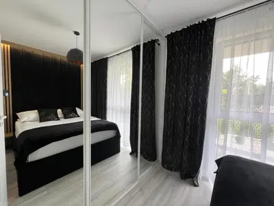 Łóżko lub łóżka w pokoju w obiekcie Apartament Poznańska 2