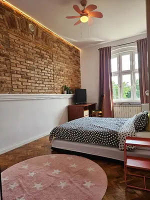 Łóżko lub łóżka w pokoju w obiekcie Apartamenty pod Aniołami