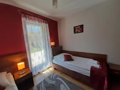 Łóżko lub łóżka w pokoju w obiekcie Pensjonat Zielone Wzgórze w Bolesławowie