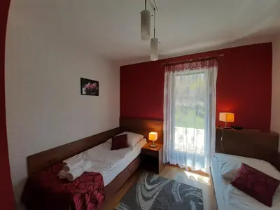 Łóżko lub łóżka w pokoju w obiekcie Pensjonat Zielone Wzgórze w Bolesławowie