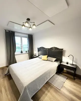 Łóżko lub łóżka w pokoju w obiekcie Apartament Antracytowe Wrota