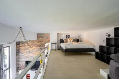Łóżko lub łóżka w pokoju w obiekcie RentPlanet - Apartament Matejki