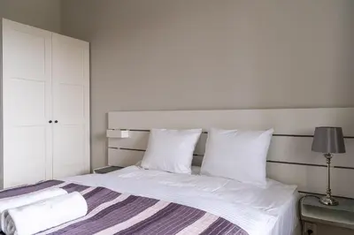 Łóżko lub łóżka w pokoju w obiekcie RentPlanet - Apartament Miedziana