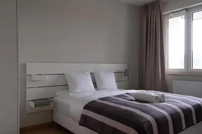 Łóżko lub łóżka w pokoju w obiekcie RentPlanet - Apartament Miedziana