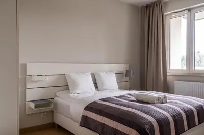 Łóżko lub łóżka w pokoju w obiekcie RentPlanet - Apartament Miedziana