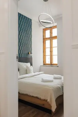 Łóżko lub łóżka w pokoju w obiekcie Apartament Rynek Kielbasnicza