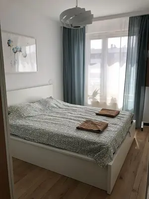Łóżko lub łóżka w pokoju w obiekcie Słoneczny Apartament