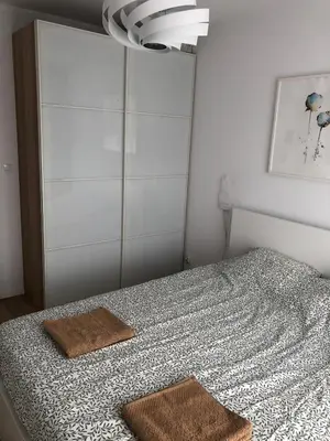 Łóżko lub łóżka w pokoju w obiekcie Słoneczny Apartament
