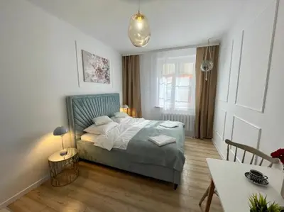 Łóżko lub łóżka w pokoju w obiekcie Dan Apartament, Self check-in