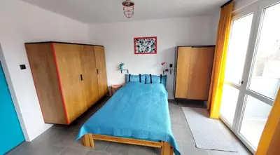 Łóżko lub łóżka w pokoju w obiekcie Lovcik PRL