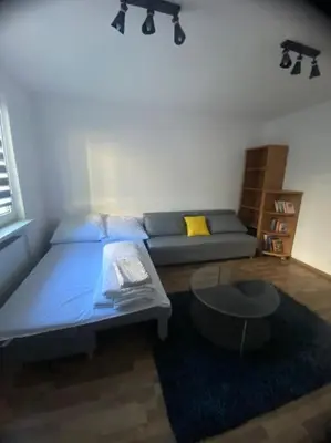 Łóżko lub łóżka w pokoju w obiekcie Pod Wieżą