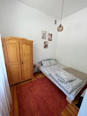 Łóżko lub łóżka w pokoju w obiekcie Apartament Snooze