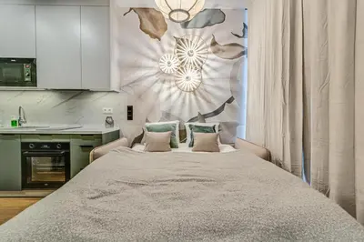 Łóżko lub łóżka w pokoju w obiekcie RentPlanet - Apartamenty Dmowskiego