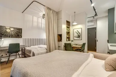 Łóżko lub łóżka w pokoju w obiekcie RentPlanet - Apartamenty Dmowskiego