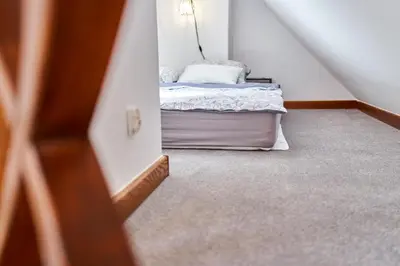 Łóżko lub łóżka w pokoju w obiekcie Apartamenty Sowi Most