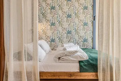 Łóżko lub łóżka w pokoju w obiekcie RentPlanet - Apartament Powstańców Śląskich