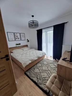 Łóżko lub łóżka w pokoju w obiekcie Aleja Ogrodowa z Jacuzzi