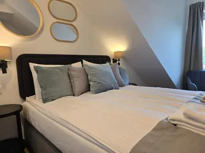 Łóżko lub łóżka w pokoju w obiekcie Apartments Orkana Street