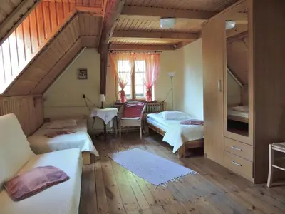 Łóżko lub łóżka w pokoju w obiekcie Agroturystyka Pod Jesionami