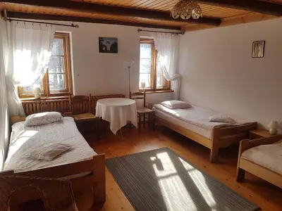 Łóżko lub łóżka w pokoju w obiekcie Agroturystyka Pod Jesionami