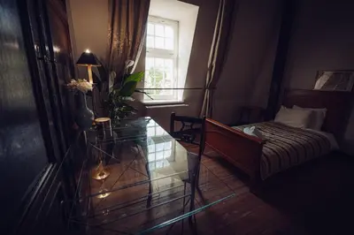 Łóżko lub łóżka w pokoju w obiekcie Pałac Borowa