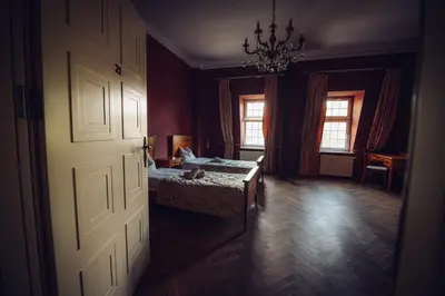 Łóżko lub łóżka w pokoju w obiekcie Pałac Borowa
