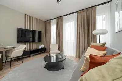 Telewizja i/lub zestaw kina domowego w obiekcie Apartamenty Zwycięska z klimatyzacją, FREE GARAGE Wrocław by Noclegi Renters