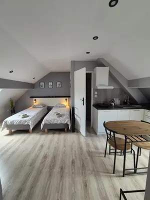 Łóżko lub łóżka w pokoju w obiekcie Apartament na poddaszu
