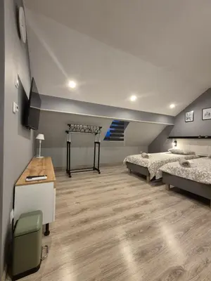 Łóżko lub łóżka w pokoju w obiekcie Apartament na poddaszu