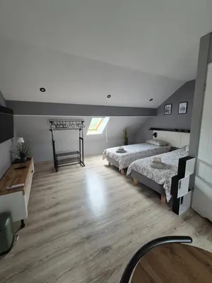 Łóżko lub łóżka w pokoju w obiekcie Apartament na poddaszu