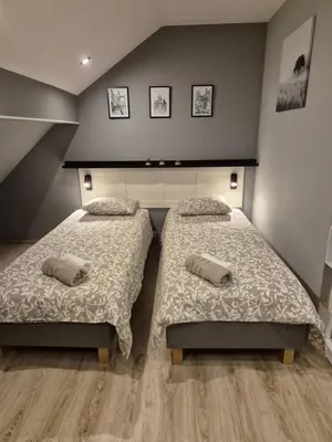 Łóżko lub łóżka w pokoju w obiekcie Apartament na poddaszu