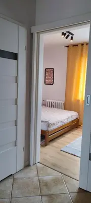 Łóżko lub łóżka w pokoju w obiekcie Apartament Lubin