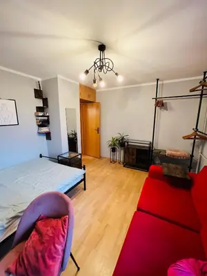 Łóżko lub łóżka w pokoju w obiekcie Stylowe mieszkanie w centrum Opola