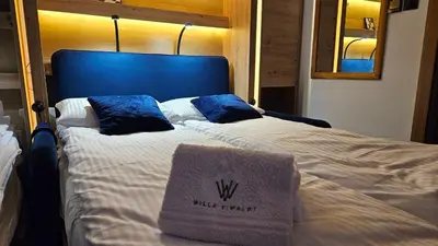 Łóżko lub łóżka w pokoju w obiekcie Apartament ViWaldi bike and ski