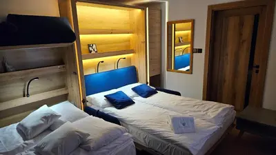 Łóżko lub łóżka w pokoju w obiekcie Apartament ViWaldi bike and ski