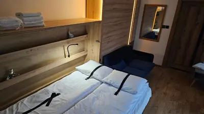 Łóżko lub łóżka w pokoju w obiekcie Apartament ViWaldi bike and ski