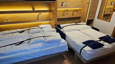 Łóżko lub łóżka w pokoju w obiekcie Apartament ViWaldi bike and ski