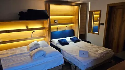 Łóżko lub łóżka w pokoju w obiekcie Apartament ViWaldi bike and ski