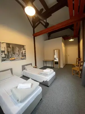 Łóżko lub łóżka w pokoju w obiekcie Młyn Witowice
