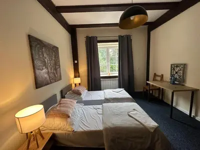 Łóżko lub łóżka w pokoju w obiekcie Młyn Witowice
