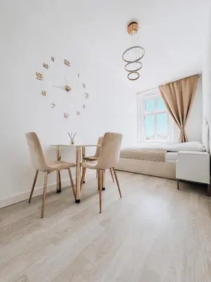 Łóżko lub łóżka w pokoju w obiekcie Złote Apartamenty Kłodzko