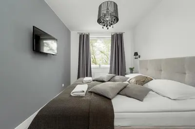 Łóżko lub łóżka w pokoju w obiekcie Apartament Blisko Rzeki Tuż przy Porcie we Wrocławiu z Parkingiem by Noclegi Renters