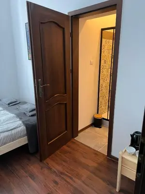 Łóżko lub łóżka w pokoju w obiekcie Śródmieście 2