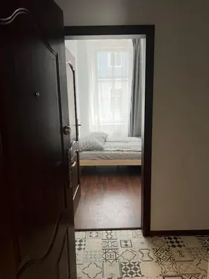 Łóżko lub łóżka w pokoju w obiekcie Śródmieście 2